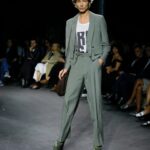 Vivienne Westwood Instagram - Look #16, featuring the Cropped Bellboy Jacket, styled alongside the Humphrey trousers in silk linen, from the Andreas Kronthaler for Vivienne Westwood Spring-Summer 2024 collection.⁠
⁠
#AKVWSS24