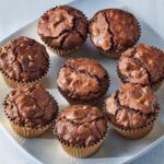 Martha Stewart Instagram - A chocolate lover's dream, these triple chocolate brownie cups are the most chocolaty treat we know. When you mix the different chocolates in this recipe, the result is a dense, dark chocolate brownie base that’s studded with milk-chocolate and white-chocolate chips. Baked in muffin cups, they’re easy to transport to a potluck or party and fit nicely into a lunchbox. Get the recipe at the link in our bio. 📷: @rachelfromiowa
