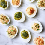 Martha Stewart Instagram - When it comes to this iconic appetizer, the devil is in the details. We cook the eggs for exactly eight minutes, then whir butter into the yolks to ensure pillowy creaminess and pipe the filling into the whites. A sprinkle of paprika is all the garnish needed. Once you've cracked the technique with this recipe, venture out of your shell by trying our three other delicious variations: smoked trout, pesto, and spiced hummus. Serve this perpetual crowd-pleaser at your Kentucky Derby party this weekend. Get the recipe at the link in our bio. 📷: @ksears recipe: @shirabocar food styling: @chrisnlanier prop styling: @suzie_myers