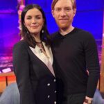 Aisling Bea Instagram - #aliceandjack EP 2 airs tonight on @channel4 but ALL 6 eps are NOW on All4❤️. So live your life how you see fit. These are recent bits of press pics I was too lazy/ without the spirit of the 20 year old I consider myself to be to do social media for. I tag all the things I wear because they are pretty much all from nice small companies, often female founded who are doing the lard’s work. And also people ask & this way is less admin for ole Beazer. 1 - Myself & Domhnall looking like proud godparents at a christening on @latelaterte show last week (Working Girl power suit dress loaned from female tailor company who I LOVE @thedecklondon_ & earrings from London company @alighieri_jewellery which I got years ago & adore) 2 - With @thewhitmore & @patrickielty - we had much fun, thanks for having us on the show all Irish people get nervous about doing. 3 @thismorning with my Queen @alisonhammond55 & cousin from Wexford @dermotoleary (wearing my @queensofarchive dress which is always a handy go-to.) 4 - A pale spread in between two tanned slices. The gal’s gals @joannemcnally & @voguewilliams having me as their prestigious 3rd ever guest on @mtgmstore podcast. Out now. 5 - At the @bafta screening & q&a wearing Irish designer @robynlynchireland 6 Another shout out to @thedecklondon_ for my pink suit for the @bafta @vanityfair party - yes I know my phone case is awful, but she’s mine & I never forget her in taxis. 7 The gorgeous @michelle_kinsella_makeup & @bernadetteb_ from @hairpeople.salon doing a great job at grooming me, so to speak. Thanks also to @rowan.qms at @qmsmedicosmetics for making my face less of a mess & shining me up in time. 8 My Mam and Aunt Bernie looking gorgeous & me wearing the hell out of my Donegal tweed @thelandskein - an Irish slow fashion brand founded by a lovely lady who makes things you buy to wear for a lifetime. 9 @chooselove necklace by @racheljacksonjewellery with profits going to the charity. 10 With the lovely @gabbylogan @gareththomasofficial @acuthbert14 @jj.chalmers on Sin Bin wearing old clothes which in no way matched the sport’s brief. #aislingrecommendsecoorsociallyconsciousbrandseverydayuntilxmas