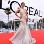 Aja Naomi King Instagram - Another Incredible experience at Cannes ♥️ So much love to my @lorealparis family for making all of this possible! Hair @stephanelancien Make Up @famidamua Styling #waymanandmicah wearing this stunning @gauravguptaofficial gown #cannesfilmfestival #lorealparis #worthit