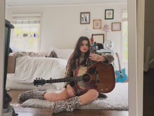Alexis Jayde Burnett Instagram - this guitar knows everything