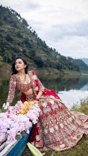 Alisha Rai Instagram - Swornim Studio’s “Kamal Shrinkhala” in Red: The Epitome of Elegance🌹

With intricate detailing and a rich red color palette, @alisha_rai_official_ has managed to capture the essence of tradition and contemporary elegance, making it an ideal choice for brides-to-be. 

Jewelry Collab: @shagoonjewellers 
Team:
Photography: @rijan_satyal 
Videography: @czan_ 
Photography assistant: @mahendra_baniya_12 
Main Assistants: @aarav_singh1 @rabin_pry 
Muses/Models: @alisha_rai_official_ Stylist: @marcos_blenden 
Makeup Artist: @sangu_lamtari 
Hair Artist: @hairartist.durga 
Flowers & decor: @mimachhadecor 

#SwornimStudio #KamalSrinkhala #WeddingCollection #LuxuryBridalWearBySwornimStudio #LuxuryNepaliBridalWear #Swornim #Kamal #WeddingLehenga #NepaliDesigner #NepaliWeddingdesigner #WeddingLehengaInspiration #Nepaliwedding #NepaliWeddingDiaries