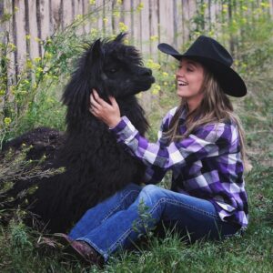 Amber Marshall Instagram - #MarshallSundayStory: Last week I told you the story of how my cat Turner came to live with me. This week, (after many requests) we will learn more about #BettyTheAlpaca who lived with us for a decade before she crossed the rainbow bridge. 

It was the summer of 2013 and I was at a ranch with my friend @KatieConnolley looking at some horses that were for sale. There was a lone alpaca there, so asked what her story was. The owner said he didn’t know how old she was, or much about her, as she had been left behind from a previous herd. He then said, “If you want her she’s yours.” 

I had no experience with llamas or alpacas but something about her just made me want to bring her home. She was not tame, and we had to wrangle her into a small pen, then rope and tackle her. I put an old t-shirt over her face to keep her calm, then we lifted her into the backseat of my truck - we hadn’t brought a trailer, so I sat holding her while my friend Katie drove us home (see last photo that was taken when we arrived home). 

I decided to turn her out with my cows so she wasn’t alone, and instantly she loped over to the young calves and started grooming them. She became Nanny Betty from then on. She took her job so seriously she would never let the calves out of her sight. My moma cows began trusting Betty, and would leave their calves with her for hours while they went out further to graze. 
Over the years Betty really warmed up to me. She even learned how to be haltered and walk nicely while being led. I miss Betty, as do my cows, and I’m not sure I will ever find another alpaca like her. ❤️

🦙 Story too long for this post, I have continued in the comments. 

See more of Betty on Instagram here: #BettyTheAlpaca