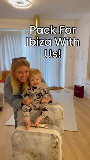 Amy Hart Instagram - Pack with us for Ibiza! 🌴 👶🏼 🧳 *disclaimer* Sam says I look miserable…this is a realistic, RBF, one hour to pack and film it, watching Eastenders at the same time kinda vid. Like how real do you want?! 🤣🤣🤣

Holiday: Ibiza, Villa, 6 nights, a wedding.

Hand Luggage: 
•Drink
•Calpol
•Nappies
•Wipes
•Cream
•Bags
•Snacks (pack loads, then pack more, then chuck a few extra in)
•Busybook, suction spinner, books.
•Bib
•Bottle
•Emergency food pouch
•Spare outfit 
•spoons

Main Case: 
3xPjs, 5xEvening, 6x Daytime, 2x Page Boy, 5x Socks, 2xVests, UV swim suits, Giant Muslin, Regular Muslin, Bibs, Nappies, Wipes, Swim Nappies, Pram Fan, Parasol, Plate, Bowl, Spoons, Porridge, Snacks, Bath Wash, Eczema Creams, Sun Cream, Hair Stuff, Sunglasses, Hats, Jackets, Toys.

#ibiza #familyholiday #packingtips #packinghacks #familypacking #babypacking #travelwithbaby #familytravel