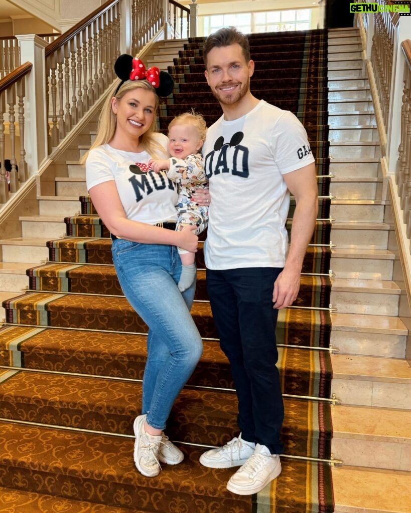 Amy Hart Instagram - Few more Family Snaps and how we got them! 🐭📸 1) On the grand staircase at Disneyland Hotel (lots of people still asking what the best way to book this is, all the info is in my massive trip report but we booked with @attractionticketsdotcom ). The level of customer service in this hotel is just mega!! There are so many cast members ready to help you. In the lobby there are people milling around in the uniform but with a top hat on…they know all the photo spots, all the angles AND the lovely lady who took this got a shiny sticker out of her pocket to get Stanley’s attention 🤣 they give them out to kids in the lobby! These T-shirts are @ukgap but we got them from @nextofficial ! Stanley’s tracksuit is from @georgeatasda 2) This big throne is on the 2nd floor of the Disneyland Hotel in the corridor that goes towards the gift shop and the restaurants! 3) now, I messed up with this one a bit 🤣 everyone had said about going to the left of the castle, we got up early the day before and had pictures on a very quiet Main Street but thought I’d check it out for any lie in lovers, but I think I went too far left! This is still a nice photo (she says 🤣) but I think if you go to that little bridge behind me you get more of a front on view of the castle! It was like 5 degrees but my puffa just wasn’t looking fly 🤣 4) Whilst Sam was taking picture 2, again a cast member walked past and asked if we’d like a full family photo! I feel like Stanley looks like a proper kid in these 🤣 5) Again the lovely lady in the top hat suggested we got one in front of the fire place too! We love a helpful insta gal! Next time we go, what other iconic pics should we get?! #disney #disneyland #disneyworld #disneygram #disneylife #disneyprincess #waltdisneyworld #love #mickeymouse #marvel #starwars #disneyparks #frozen #disneyfan #disneylove #disneyplus #waltdisney #wdw #instadisney #disneylandparis #disneymagic #pixar #disneychannel #disneyaddict #toystory #disneyinsta #magickingdom #disneyphotography #disneylandhotel