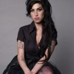 Amy Winehouse Instagram - Glamorous Amy captured in her iconic beehive & cat-eye look by photographer Jason Bell at the Elle Style Awards in 2007. 🖤