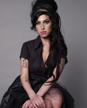 Amy Winehouse Instagram - Glamorous Amy captured in her iconic beehive & cat-eye look by photographer Jason Bell at the Elle Style Awards in 2007. 🖤