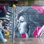 Amy Winehouse Instagram - From Hawley Arms, down to the Stables, Amy is synonymous with Camden. Thanks to @GlobalStreetArt and artists @EllesPaint and @CeeRichards_, a brand new mural has popped up underneath the Camden Town overground bridge on Camden High Street, Chalk Farm Road. Have you seen it yet? 🩷 #BackToBlack