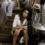 Amy Winehouse Instagram - Watch the brand new lyric video for Amy’s 3x Grammy Award winning track, Rehab. The video features unseen footage of Amy during the filming of the official music video in 2006 shot at 33 Portland Place in London. 🖤 #backtoblack