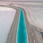 Andréane Chamberland Instagram - This man-made canal contains a concentrated brine solution that is not suitable for human consumption. This canal is a part of potash mining, which is present here due to the abundance of salt. The mine produces potash, which is a potassium-containing salt used in fertilizer. Canals transport this concentrated brine solution to evaporation pools. It is strongly advised not to swim in this area. #potash #utah #utahphotography #utahphotographer #utahunique #utahgram #utahtravels #utahlife