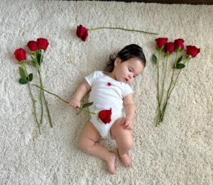 Anjelah Johnson-Reyes Instagram - My sweet angel baby. We can’t believe you’re 9 months old already! You’ve been on 13 flights. You are currently sleep training (again). You recognize your different family members on FaceTime by the things they do and say. You love your doggie brother Banzo. You gnaw on a chicken bone like a grown man and we love it! Happy 9 months #Rosieharlowreyes