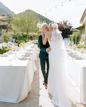 Arielle Vandenberg Instagram - I’ve always dreamed of having an intimate, backyard wedding! And two of our best friends, graciously offered their home! We wanted our wedding to be simple and sweet! And that’s exactly how it was! Bright and delicate flowers sprinkled across the tables. It definitely helped that the entire backyard had white roses in full bloom! (Gods gift saved us thousands of dollars lol). We had a deliciously unique cake that tasted of tres leches and apricot 🤤 (hands down favorite cake I’ve ever had). I’ve always wanted pizza at my wedding, so we hauled a 500 lbs pizza oven into the backyard for fresh amazing pizza! (Should have ate more that night, that’s for sure. 😂) Everyone took home Cutie cookies painted like our favorite girl, Stinky! Love was in the air as the fairy lights above our heads twinkled in the night sky and we danced the night away! ✨

Photos: @christinamcneill 
Video: @whiteinrevery 
Coordinator: @carlyraeweddings 
Dress: @chosenbykyha via @enblanc_la 
Veil: @amsale 
Glam: @afton 
Suit: @paulsmithdesign 
Catering: @madeinitalybistro 
Florals: @floretfloral 
Music: @rickyrocksdrums 
Cake: @kellygraycakes 
Cookies: @cubandcuppy 
Rentals: @lapinataparty 
Venue: @thejasonkennedy @thelaurenkennedy backyard 😍
