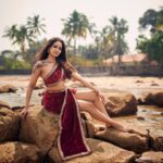 Ashi Singh Instagram - Red hot and ready to take on the ocean (or maybe just this rock for now). This dress is making waves 🌊(pun intended)! Photographer - @mirajverma_photography Makeup & Hair - @makeoverbysejalthakkar Outfit by - @jiya_fashion_designer Jewellery- @nihiraa_india X @purvabansal5 Team - @greenlight__media . . . #ashisingh #mermaidvibes #beachlife #reddress #fashiononthebeach #feelingbeautiful #oceanlove #dreamyescape #bollywood #fashion