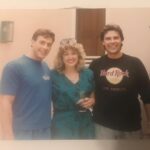 Ashley Johnson Instagram - Today is my Mom’s birthday (@viperass). She’s pretty much the greatest mother in the whole world. Here she is, looking like a boss, with my dad (on the right) and Jean Claude Van Damme (on the left). She’s wearing a hunter green onesie, burgundy acrylic nails, drinking a Diet Coke with perfectly feathered hair. I love you so much, Mom and I’m so glad you’re my Mother. When I come home, I’m taking you paintballing and I’m finally going to buy you a Sega Super Hang-On Motorcycle Arcade game.