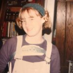 Ashley Johnson Instagram - My sister has been going through old pictures and just sent me this gem. I had to wear a back brace for 3 years, 22 hours a day (would remove for showers or baths and PE Class/sports), starting at 12 years old. Because of this, I wore overalls to hide it and had them in just about every color and material. Denim at the beginning of the week, corduroy on Thursdays and Fridays and on weekends or school dances, VELVET. Also, I very much enjoyed wearing that headband. It was an accessory that came with a terry-cloth robe from Victoria’s Secret. The intended purpose for said accessory was to hold your hair back while you wash your face. But I wore it everyday and felt VERY scandalous wearing something from Victoria’s Secret. I made sure to tell everyone where it was from. It was my SEXY item of clothing. #VictoriasSecret
