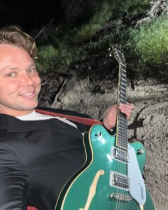 Ashton Irwin Instagram - Prepare yourself, the following is a documentation of my current existence - the first two are just me chillin during my morning guitar ritual, wake up and play - bought a BBQ - here’s where it gets strange, I’m practicing my fire twirling skills and in my head I seem to think that’s what they do at Pomona beach/ Huntington Beach New Year’s Eve 😂 big things coming from this - “throwing ass” to prince on an FM radio in my house that I use for some reason now? It just feels good to listen too - hungover at pampas Brazilian food at the grove - getting massive beers with my bud @mrjmachanson - doing 100 sumo squats a day for the foreseeable future - with my green Gretsch shooting a video in the forest in Malibu at night time, creepy but cool Living La Vida Loca Ciao! X’s 💋