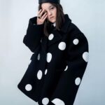 Bella Ramsey Instagram - Posted @withregram • @britishvogue “‘They’ pronouns are the most truthful for me,” @BellaRamsey shares in #BritishVogue’s July 2023 issue. Having first appeared in #GameOfThrones aged just 11, the now 19-year-old actor became Hollywood’s most in-demand young star overnight when they landed the role of Ellie in ‘The Last of Us’ – and credits both #PedroPascal and their “gay army” with supporting them through the intense press scrutiny that followed. Click the link in bio to read the profile in full, and find the Pride portfolio in the new issue, on newsstands Tuesday 20 June. #BellaRamsey wears a coat, shirt and tie by @MaisonValentino, crown by @Mr_Riegillio, silver ring by @ShaunLeaneJewellery and silver and onyx ring by @TheGreatFrogLDN, photographed by #TimWalker and styled by @KPhelan123, with hair by @AliPirzadeh, make-up by @BeaSweetBeauty, nails by @Simmy_NailsAndBeauty and production by @Zoe_Wassall at @GreatSouthernProductions. [Image Description: Image shows Bella Ramsey, a white non-binary actor with straight brown hair, standing against a grey backdrop. They are wearing an oversized black blazer with big white spots, and a black crown. Their left hand rests gently on a surface in front of them, and their right arm is lifted, with their fingers covering their right eye.]