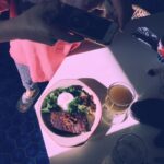 Bridgit Mendler Instagram – Beautiful roomie anniversary meal. Must have photo op #SteakAndEggs