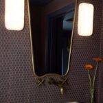 Caity Lotz Instagram - The difference good lighting can make 😍 Kyle thought I was crazy when I said we needed 8 switches for a small spaces like this 🤣 so worth it! love these fixtures… Adara Pendant and Freesia Wall Sconce by @corbettlighting Bathroom Grand Central Wall Sconces by @hudsonvalleylighting #corbettlighting #hudsonvalleylighting #troylighting