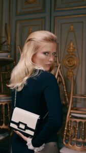 Camille Razat Instagram - This season's new Belle Vivier patent-leather bag with iconic lacquered buckle and magnetic flap closure is full of Sixties charm. French actress and brand ambassador Camille Razat shows what a fun and versatile addition it is to any outfit or mood. #RogerVivier #RogerVivierFW23 #GherardoFelloni #CamilleRazat