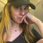Cara Buono Instagram - Plane selfies. Been a while. Dark circles and top knot. #plane #travel #switzerland #zurich #instagood #basel #topknot #strangerthings