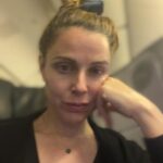 Cara Buono Instagram - Plane selfies. Been a while. Dark circles and top knot. #plane #travel #switzerland #zurich #instagood #basel #topknot #strangerthings