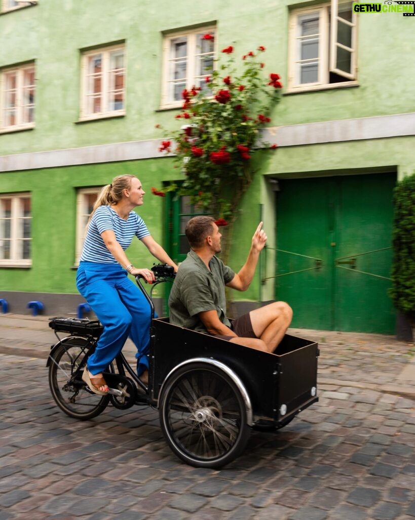 Caroline Wozniacki Instagram - Hey everyone! 🚴‍♀️ @carowozniacki here. Let's talk about getting around in Copenhagen. @davidlee and I had a blast testing a cargo bike, all thanks to my collaboration with @VisitCopenhagen! 👇 Did you know that Copenhagen has proudly been holding the title of the most bicycle-friendly capital since 2015? Pedaling through this city is not just a mode of transport but a way of life. Picture this: curb-separated bicycle tracks, charming bike bridges over the canals, dedicated cycle superhighways, and even traffic lights and green waves designed for two-wheeled commuters. Bikes outnumber cars, and here, taking your kids to school in a cargo bike is cooler than cruising in an SUV. And let's not forget about the iconic harbour busses were you can bring your bike and smoothly glide along the waterways. The stunning waterfront views make every ride an experience in itself. Stay tuned as I continue to explore Copenhagen's gems 👋❤️ #beautifuldestinations #instagood #igerscopenhagen #photography #featuremevisitcopenhagen #travel #visitcopenhagen #ibyen #copenhagen #denmark #cphpicks #sharingcph #delditkbh #wanderlust