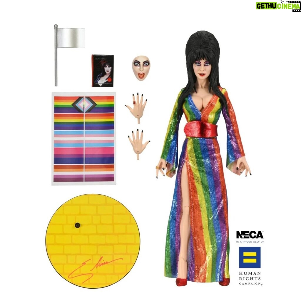 Cassandra Peterson Instagram - NECA is celebrating Pride Month early with a brand new Elvira action figure, this one a variant dubbed “Over the Rainbow Elvira.” And it’s been released this week for a great cause. NECA previews, “The devilishly delightful Cassandra Peterson has played the part of Elvira for more than 40 years with grace, humor and more than a little camp. NECA is proud to present this “Over the Rainbow” Elvira figure, celebrating the horror and queer icon in a never-before-seen, sparkling rainbow dress for your collection. “To spread the love, when you place an order for the Over the Rainbow Elvira on THENECASTORE.COM, you’ll receive free shipping! We’ve also joined with Cassandra to support equality for all. NECA and Elvira are proud donors to the Human Rights Campaign, which strives to end discrimination against LGBTQ people. “With an original tailored fabric gown, glittery ruby red heels, and a yellow brick display base, she’s definitely not in Kansas anymore! This fully articulated 8-inch action figure features new faceplate technology with two interchangeable expressions and hands, including brand new ones that allow you to recreate Elvira’s signature pose! She comes with a book accessory of Peterson’s memoir, Yours Cruelly, Elvira, and a double-sided flag with 10 stickers to customize and show your unique pride! Collector-friendly window box packaging.” The best part? $10 from every purchase will benefit the Human Rights Campaign, which is the largest LGBTQ political lobbying organization within the United States.