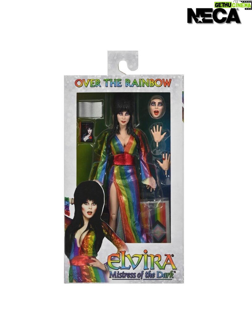 Cassandra Peterson Instagram - ANNOUNCEMENT! 🏳️‍🌈 🖤 ➖ Elvira - Over the Rainbow Elvira 8” Clothed Figure ➖ Celebrate Pride Month with Elvira, Mistress of the Dark! The devilishly delightful Cassandra Peterson has played the part of Elvira for more than 40 years with grace, humor and more than a little camp. NECA is proud to present this “Over the Rainbow” Elvira figure, celebrating the horror and queer icon in a never-before-seen, sparkling rainbow dress for your collection. With an original tailored fabric gown, glittery ruby red heels, and a yellow brick display base, she’s definitely not in Kansas anymore! This fully articulated 8-inch action figure features new faceplate technology with two interchangeable expressions and hands, including brand new ones that allow you to recreate Elvira’s signature pose! She comes with a book accessory of Peterson’s memoir, “Yours Cruelly, Elvira”, and a double-sided flag with 10 stickers to customize and show your unique pride!  ➖ Available now on thenecastore.com, and shipping to your favorite NECA retailer in June! ➖ #Elvira #MistressoftheDark #Pride #OvertheRainbow #CassandraPeterson #NECA #actionfigure