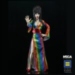 Cassandra Peterson Instagram - 🌈Elvira - Over the Rainbow Elvira 8” Clothed Figure is DROPPING on the NECA Store at 12pm ET! 🏳️‍🌈 🖤 Link in bio. ➖ Celebrate Pride Month with Elvira, Mistress of the Dark! The devilishly delightful Cassandra Peterson has played the part of Elvira for more than 40 years with grace, humor and more than a little camp. NECA is proud to present this “Over the Rainbow” Elvira figure, celebrating the horror and queer icon in a never-before-seen, sparkling rainbow dress for your collection. To spread the love, when you place an order for the Over the Rainbow Elvira on THENECASTORE.COM, you’ll receive free shipping! We’ve also joined with Cassandra to support equality for all. NECA and Elvira are proud donors to the Human Rights Campaign, which strives to end discrimination against LGBTQ people. With an original tailored fabric gown, glittery ruby red heels, and a yellow brick display base, she’s definitely not in Kansas anymore! This fully articulated 8-inch action figure features new faceplate technology with two interchangeable expressions and hands, including brand new ones that allow you to recreate Elvira’s signature pose! She comes with a book accessory of Peterson’s memoir, Yours Cruelly, Elvira, and a double-sided flag with 10 stickers to customize and show your unique pride! Collector-friendly window box packaging.  ➖ In-Stock now! ➖ 🌈Free shipping only applies to the Elvira - Over the Rainbow Elvira 8” Clothed Figure. 🌈A limited number come with an autograph card signed by Elvira herself! ✍️🖤 ➖ #MonsterMAYhem #Elvira #MistressoftheDark #Pride #OvertheRainbow #CassandraPeterson #NECA #NECAStore #actionfigure