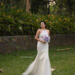 Chaithania Prakash Instagram - 🕊🤍 Airbrush makeup done with Christian gown for @briella.in Amazing gown : @briella.in Bouquet : @briellaflorals Photography : @sharon.shyam @storiesbysharonshyam Makeup & hairstyle : @soumyashyam_makeupartist Location : Whispering water resort Reels : @jeeva_balakrishnan @sumin_s_kumar Thanks : @shinil__vinod
