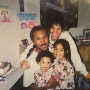 Chelsea Tavares Instagram - It’s been a month since My dad has passed. we were all nervous about posting it, because it makes it a bit more real , now that it’s public. A Post will never hold enough weight to let people know how much you impacted us and others around us. From our family, to friends, to neighbors, to the people that worked at your favorite donut shop. you were the person that loved and people called on. You were the Father to people that didn’t have a father . when our friends and ex’s fly out of state just to see you one more time before you go, you know you’re the shit. No matter what happened in life, you were always there. Always on time to pick us up from school, or the airport. You were the cook of the house. we were the house, where you knew my dad was gonna grill and make some bomb burgers or steak while mommy drank her white wine and cleaned.  you quietly sized up all of me and my sisters dates.. You would leave Hershey chocolate bars on our pillows in the morning every valentine’s day. Even when mommy was mad, you grabbed her , kissed her, and would squeeze her butt until she laughed. when i think of GOOD CLASSIC music. like that bobby Caldwell , Phil collins, The Beatles, Debarge music. I think of you. The Police was our favorite band. we would play it driving down to San diego. we shared our love for vintage cars and black and white movies.  you made me Look up all of the black actresses & singers that i didn’t know about from the 40’s and 50’s.  Koden keeps asking for “pop pop”. it’s really hard to answer him. you said watching a movie and having a bowl of Vanilla ice cream with him , was you and koden’s “thing”. so I will continue to remind him of that. he had a bowl the other day ♥️ Currently wearing your T shirt and the bracelet you got me for my 30th.  It’s so surreal. I wish I could hug you, i wish you would call me saying “i don’t want nothing, just want to tell you I love you.” There is always gonna be a hole in my heart. I wish you could have walked us down the aisle, but i believe we have too much character and personality for the spirit to just not be here any more. i can literally feel you around. we just miss you. that’s all. ♥️your “Chelsea Baby”