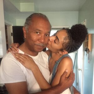 Chelsea Tavares Instagram - It’s been a month since My dad has passed. we were all nervous about posting it, because it makes it a bit more real , now that it’s public. A Post will never hold enough weight to let people know how much you impacted us and others around us. From our family, to friends, to neighbors, to the people that worked at your favorite donut shop. you were the person that loved and people called on. You were the Father to people that didn’t have a father . when our friends and ex’s fly out of state just to see you one more time before you go, you know you’re the shit. No matter what happened in life, you were always there. Always on time to pick us up from school, or the airport. You were the cook of the house. we were the house, where you knew my dad was gonna grill and make some bomb burgers or steak while mommy drank her white wine and cleaned.  you quietly sized up all of me and my sisters dates.. You would leave Hershey chocolate bars on our pillows in the morning every valentine’s day. Even when mommy was mad, you grabbed her , kissed her, and would squeeze her butt until she laughed. when i think of GOOD CLASSIC music. like that bobby Caldwell , Phil collins, The Beatles, Debarge music. I think of you. The Police was our favorite band. we would play it driving down to San diego. we shared our love for vintage cars and black and white movies.  you made me Look up all of the black actresses & singers that i didn’t know about from the 40’s and 50’s.  Koden keeps asking for “pop pop”. it’s really hard to answer him. you said watching a movie and having a bowl of Vanilla ice cream with him , was you and koden’s “thing”. so I will continue to remind him of that. he had a bowl the other day ♥️ Currently wearing your T shirt and the bracelet you got me for my 30th.  It’s so surreal. I wish I could hug you, i wish you would call me saying “i don’t want nothing, just want to tell you I love you.” There is always gonna be a hole in my heart. I wish you could have walked us down the aisle, but i believe we have too much character and personality for the spirit to just not be here any more. i can literally feel you around. we just miss you. that’s all. ♥️your “Chelsea Baby”