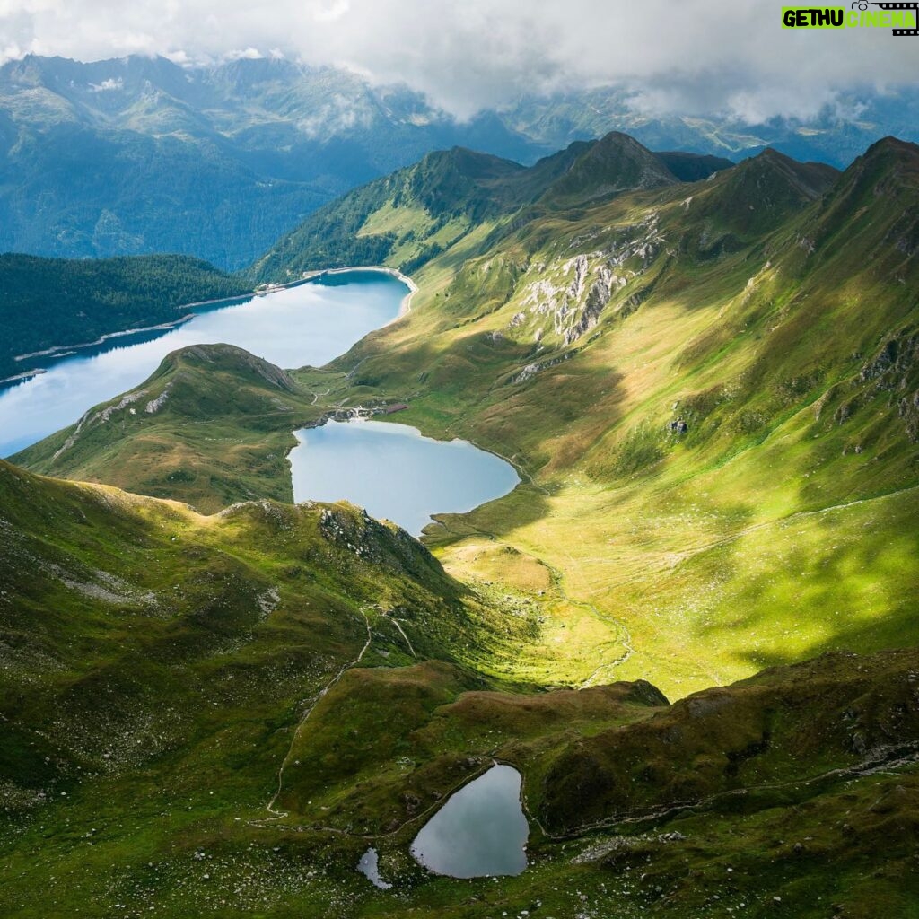 Chris Burkard Instagram - It’s wild to consider the amount of life these mountains have witnessed throughout different chapters in the history of the world... Hannibal leading the Carthaginian army across the alps in 218 BC to the development of alpinism and years of brave people ticking off first ascents with only rudimentary gear and a strong will. Every time I set foot in them.. it invites a way of life that encourages constant awareness without distraction. You have to pay attention to your surroundings but you also feel at peace with that rhythm of life - something I find harder to achieve surrounded by man made structures. These images come from 2016 on a perfect day in the Swiss alps.. gazing down at Lake Ritom with a bit of disbelief at our luck finding a glassy lake with a backdrop more like a painting than reality…