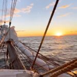 Chris Burkard Instagram – For many of Iceland’s Eastfjords, fishing & boats were (and still is) a large part of industry & life supporting little towns like Eskifjörður or Seyðisfjörður… so it felt fitting to explore the East sailing aboard the @schooneropal with an amazing crew of good friends on a trip with @66north 
This particular vessel was built in 1951, sailing in the Baltic & North seas and completed two trans-Atlantic crossings before becoming part of North Sailing’s fleet in 2013, now based in Iceland. The slow pace of the ship, sounds of the sails billowing in the wind, and occasional creaking of timber with the rocking of the ocean – quickly puts you in tune with the pace of the sea and the surrounding fjords… a pretty special way to see a landscape & an opportunity I always try to jump on if given the chance.