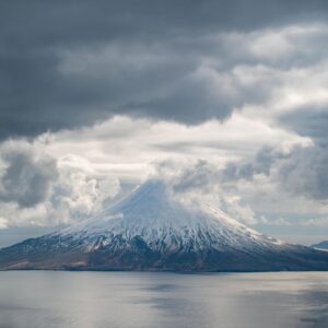 Chris Burkard Instagram - Stretching between the shores of Alaska and Russia, this chain of 14 volcanoes and 55 smaller land masses make up what is known as the Aleutian Islands… one of the most remote and difficult landscapes I’ve photographed -  due to the harsh storms the frequent the Bering sea that often shrouds them in thick clouds & fog. In the past, I had set out to these islands with the goal of surfing in mind.. but in 2018, I received a grant from Conservation International to document the Alaska Maritime Wildlife Refuge - focusing more on showing the scope of the landscape and it’s largely undisturbed beauty. 
We caught a window in the weather - so I grabbed my camera & jumped in a small plane… resulting in some of the most unforgettable aerial views of my career.