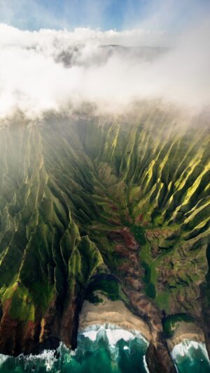Chris Burkard Instagram - I often talk about the colder regions of the world and am admittedly drawn to them… but to this day, the Napali Coast is still one of the most dramatic and stunning landscapes I’ve had the opportunity to photograph. Some of the steepest, knife edge ridges held together by thriving plant life feels like something you’d only see in Jurassic Park and instantly inspired me to find the aerial perspective during a personal trip with my family in 2018. I shot this video from my iPhone before reels were a thing so I could remember this surreal experience in a little more unfiltered way.