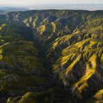 Chris Burkard Instagram - California’s Carrizo Plains & Cuyama Valley provide little access even with a good 4x4 vehicle for those hoping to photograph the surrounding ridges… while planning this particular assignment, we felt that flying in an Lightweight Aerial Trike and a Cessna seemed the best way to capture the dramatic effects of the super bloom in a way that gave genuine context to the landscape… something I value when putting together a body of work. Throughout my career, @natgeo has always been an incredible example of showcasing the earth and the important stories that it has to share… so this assignment to document California’s super bloom following significant winter rainfall in 2023 felt a little extra special being so close to my home.