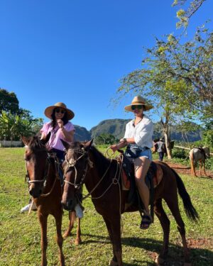 Chrissie Fit Instagram - Who would’ve pegged me as a guajira? Los paisajes de Cuba son una maravilla. The Cuban countryside is unreal. I recommend you go there and buy tobacco directly from the farmers. They are forced to give 90% of their crops to the government and only have 10% to sell themselves. It’s more authentic this way and you’re helping the farmer, who takes so much pride in growing their tobacco, fruits, veggies, and coffee. Btw, I did not know how to smoke a cigar. At the risk of losing my Cuban card, I will post in my stories 😅

#Cuba #Vinales #CuevaDelIndio #palenquedeloscimarrones #cubancountryside #ReturnToMyRoots #CubanHeritage #Cuban #Guajiro #Guajira