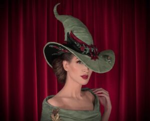 Christine McConnell Instagram - A hand crafted Witch’s Hat 🎄🐸🎄

I was inspired by the amazing hat @lordxblackwood made for me in 2019 and decided to have a go at making my own 🎉

It was built using window screening as the base. I then hand sculpted “Pancake” the Frog, as well as the buckle ✨

Full episodes are on Patreon 🪄