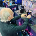 Christopher Lloyd Instagram - Doc is the master of Time and mini Tempest arcade game from @newwavetoys at @nostalgiacon80s 📷 @jja_iii