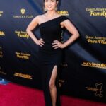 Danica McKellar Instagram - Oh hi, red carpet - it had been a minute! 🥰 What an incredible night - a beautiful red carpet and a @movieguide awards ceremony I was honored to co-host alongside @trevordonovan amidst our @greatamericanfamily ! Here's the lowdown on the pics: . . 1. Red carpet shot 2. Another red carpet shot 😅 3. Red carpet with my amazing husband! 4. Selfie w/@candacecbure 💕 5. Group shot with many actors and executives of @greatamericanfamily - including our CEO @billabbotthc! 🤗 6. Stepping onstage to host with @trevordonovan 7. Trevor was so much fun to host with! 8. Backstage shot with @MovieGuide owner @tedbaehr and legend @dennisquaid - who performed some awesome tunes! 🤗 9. Post-show laughs with my dear friend Lori Loughlin. 💕 . . I hope you'll join us one week from tonight - March 7th at 8pmET on @greatamericanfamily! 🍿🎬❤️