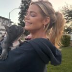 Denise Richards Instagram - Happy Easter!!! 🐣 My daughter brought a surprise & adopted this lil one for me. His name is Maverick after Tommy Cruise @tomcruise in #topgun obviously. He's a little buttercup we love him already. Have a wonderful Easter... 🐣