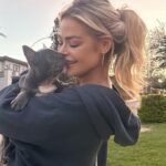 Denise Richards Instagram - Happy Easter!!! 🐣 My daughter brought a surprise & adopted this lil one for me. His name is Maverick after Tommy Cruise @tomcruise in #topgun obviously. He's a little buttercup we love him already. Have a wonderful Easter... 🐣
