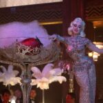 Dita Von Teese Instagram - A still photo from the set of @dontworrydarling and today’s @voguemagazine piece: https://www.vogue.com/article/dita-von-teese-dont-worry-darling-cameo-interview/amp See it live, only on the Glamonatrix tour @ticketmaster ✨🍓🥂 #dontworrydarling #Glamonatrix #swarovski @catherinedlish