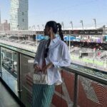 Emily Canham Instagram - its fun.. but is it too fun? I think no. Get dressed with me for qualifying 🏎️ Full fit @tommyhilfiger #SaudiArabianGP #F1 #ootd #tommyhilfiger ad-pr