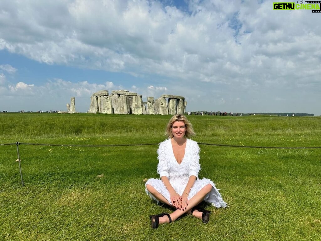 Eugenia Kuzmina Instagram - Happy Mother’s Day ☀️💗🦋 …. Meditating at #stonhenge #mothernature #moon #sun 🌙☀️🌿 #magic …. I don’t post pics of my family anymore on purpose to protect what’s sacred 💜 dress @karnitaharoni_official