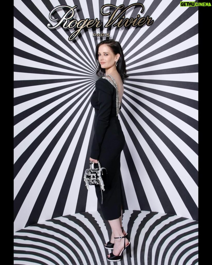 Eva Green Instagram - Such great pleasure and happiness yesterday to be with @rogervivier in Paris . Thank you to @gherardofelloni and his beautiful team. The kindest and most lovely people. The collection is exquisite - full of love , creativity and invention. You will love it, just as I did. It really is something to celebrate. Generous and beautiful. Bravo mes amis !! #vivieroptical #rogervivier 💙🌀💙 Styling: @mistersamuelf Dress: @alexandrevauthier Shoes: @rogervivier Hair: @perrinerougemonthair Make Up: @hungvanngo
