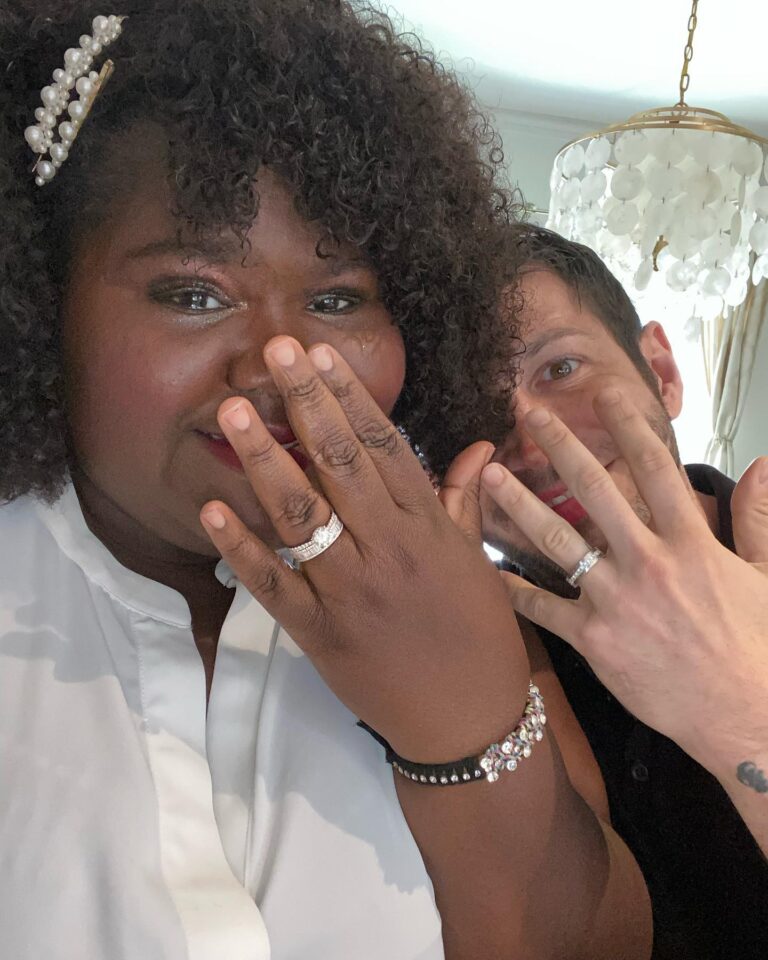 Gabourey Sidibe Instagram - These are our official wedding photos! The Wedding at the kitchen counter featuring our rings by @happyjewelers, followed by an extremely lit reception with Aaron sniffing flowers sent to us and then a very romantic sunset dinner featuring our mask because we were still in the thick of the pandemic. We really do want to have a wedding someday but I just couldn’t wait to marry this amazing man.